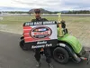 Lance Mackey is picured with a trophy after winning the 25-lap legends race at Alaska Raceway Park June 25, 2016. Mackey, a four-time Iditarod Trail Sled Dog Race champion, surprised race off