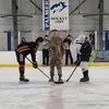 Houston's Eric Preboski participates in the ceremonial puck drop on the first day of the Alaska Army National Guard Stars and Stripes Showdown. Courtesy of Palmer hockey