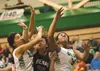 Colony’s Chase Stephens and Jennifer Solano collide with Kenai’s Caitie Steinbeck during quarterfinal competition at the Northern Lights Conference Championships Thursday at Colony High Schoo