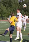 Wasilla senior captain Cash McGregor uses a header to knock the ball into play during a 1-0 win over Homer May 23 at Wasilla High. McGregor used another header to score the lone goal in the g