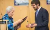 Mendy Greenberg receives a proclamation from Mat-Su Borough Mayor Edna DeVries recognizing Education and Sharing Day. J. David McChesney/Frontiersman