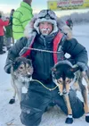 Eddie Burke poses for a photo at the Knik 200 finish line in 2023. Courtesy photo by Sherri DeCoursey