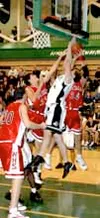 Colony's Tim Egger battles Wasilla's Weston Espinoza (32) and
Matt Crane (34) for the rebound during the Warriors' 58-46 win over
Colony Tuesday. Photo by JEREMIAH BARTZ/ Frontiersman.
