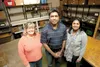 Frontline Mission volunteer Patti Peppered, Wasilla Lake Church of the Nazarene Manoj Ingle and Frontline Mission director of development and communication Vandana Ingle stand inside the food