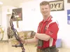 MATT TUNSETH/Frontiersman Harry Bates pauses while practicing
his bow hunting skills Sunday at Fletchers Archery in Wasilla.
Bates recently won a national bow hunting title at the National
Fi