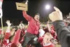 Wasilla Warrior head coach Jim Shetter is hoisted on the players
shoulders after a hard fought victory against the Palmer Moose in
the 2007 Potato Bowl Friday at Wasilla High. Wasilla hasn't 