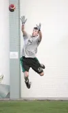 Colony's Tim Jaronik attemps to make a catch during a passing
competition Thursday at the Multi Use Sports Complex in Wasilla.
(ROBERT DeBERRY/Frontiersman)