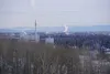 Smokestack emissions are seen along the Fairbanks skyline on March 1. At left is the coal-fired heat and power plant on the University of Alaska Fairbanks campus.  Yereth Rosen/Alaska Beacon