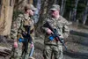 U.S. Air Force Tech. Sgt. Justin Pena (left), a defender assigned to the 673d Security Forces Squadron, and Master Sgt. Kenneth Tussey (right), a first sergeant assigned to the 354th Munition