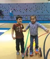 Goose Bay Elementary kindergarten students Isaac Redington and Mia Kutsev demonstrate cooperation and dynamic balance skills in physical education class. Courtesy Nancy Blake