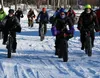 Bikers embark on Saturday's Wasilla Centennial fat bike ride with a start and finish line at the Menard Center. (Matt Hickman/Frontiersman)