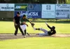 Mat-Su Miners shortstop Angelo Armenta tries to catch the ball on a hop as Anchorage's Bryant Harris slides into second safely during Anchorage's 6-5 extra-innings win over the Miners Friday,