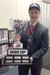 Former Wasilla standout Chancie Hanson holds the NA3HL Silver Cup after helping lead his North Iowa Bulls Junior A Tier III hockey team to its second straight league title earlier this month.