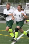 Colony seniors Ben Atkinson and Arty Fonov celebrate a Fonov goal during a 3-2 overtime win over Dimond in the boys state title game Saturday at Anchorage Football Stadium. Both Atkinson and 
