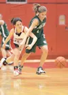 Wasilla's Shelby Fulton and Colony's Tara Garrod scramble for a
loose ball during Saturday's game at Wasilla High School. ROBERT
DeBERRY/Frontiersman