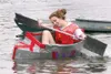 GREG JOHNSON/Frontiersman Briana Howard works to keep her Duct
Tape Regatta boat upright during the annual American Red Cross
Mat-Su event on Saturday.