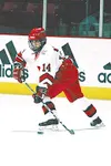 Kerry Weiland fires a puck across the ice during a recent
game.Photo courtesy of the University of Wisconsin