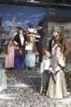 Bob Cratchitt (Ted Carney), Tiny Tim (Teresa Kennedy) and Kathy
Cratchitt (Rachel Kennedy) look on sadly as a wealthy family (Tessa
Butts, Yvonne Oliver, Lauren Gette-King, and Chad LaCroix) 