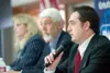 ROBERT DeBERRY/Frontiersman Palmer mayoral candidate Kevin Brown
gives his opening statement as Mike Chmielewski, center, and Delena
Johnson wait their turns at a Thursday candidates forum at