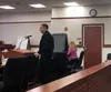 Josh Summer, of the Mat-Su Borough’s code compliance department, speaks in court Wednesday regarding what has become seen as a problem property in the Bodenburg Butte area. Tim Rockey/Frontie