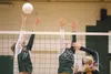 Colony’s Sophie Hall and Ashley Turcotte stop a West Valley Wolfpack spike during the first game of Thursday’s match at Colony High School. ROBERT DeBERRY/Frontiersman.com