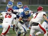 Palmer's Larry Cutsforth runs through a group of Kardinals during a 21-7 win over Kenai earlier this year. Palmer hosts Thunder Mountain in the medium-schools semifinals Saturday at 4 p.m. at