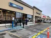 A crew works to clean up broken glass at the Wasilla Carrs/Safeway store Friday afternoon. The building was damanaged during an earthquake with a magnitude of 7.0 that hit Southcentral Alaska