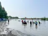 A group of swimmers plays in Man Made Lake. Amy Bushatz/For the Frontiersman