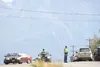 Alaska State Troopers route traffic through the parking lot at RWs Hamburger House and around the scene of a two-vehicle accident on the highway there that snarled traffic from Equestrian Acr