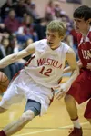 Wasilla sophomore guard Stone Krueger drives past kenai's Jonah Theisen during day two competition at the 2013 Northern Light Region III Basketball Tournament in Soldotna. ROBERT DeBERRY/Fron