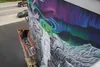 Charlene Lofgreen busily paints the finishing touches to the last of three murals for the Country Cutts hair studio. Jacob Mann/Frontiersman