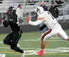 Colony senior running back Dawson Nash runs toward the sideline during a 28-21 loss to West Anchorage Friday in the large-schools quarterfinals. Nash scored all three Colony touchdowns in the