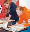 Ann Mook and Sarah Bartel work on sketches in Julia Crocetto's
watercolor class. Photo by JODI SNYDER/For the Frontiersman.