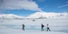 Guide Mitch Zollinger guides Kevin and his daughter back to the helicopter Pilot Shelby Tritthart has standing by to take them all from the Knik Glacier to the Colony Glacier in 2024. J. Davi
