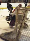 The Knights' Matt Strohmeyer shoots as Wasilla goaltender Nathan
Banbury cuts off the angle in the first period of Monday's game at
Brett Memorial Ice Arena. PHoto by TIM BRODT/Frontiersman.