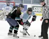Mat-Su’s Johnna Elkins works to control the puck against Chugiak-Eagle River during the girls high school hockey state tournament. BRUCE EGGLESTON/matsusports.net