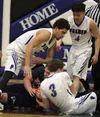 Palmer's Isaac Atkins battles with North Pole's Craig Borba for possesion during a 66-11 win over the Patriots Thursday, Jan. 18, 2018, at Palmer High School. Palmer followed the victory over