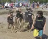 The B3nd3rs celebrate after winning their first-round game
Saturday at the 23rd annual Big Lake Lions Club Mud Volleyball
Tournament. (GREG JOHNSON/Frontiersman)
