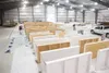 ROBERT DeBERRY/Frontiersman Work continues with painting of the
boards inside the new 26,000-square-foot Big Lake ice arena being
built off Lions Court. The Big Lake Lions Club is $44,000 awa