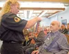 Ann Bailey presents veteran Roy Hooper with the Alaska Veterans'
Service Medal during a Veterans Day ceremony at the Alaska
Veterans' and Pioneers' Home Thursdya afternoon. (ROBERT
DeBERRY/Fr