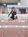 Houston Hawk sophomore Ben Bayne clears a hurdle during the boys
hurdle shuttle relay Saturday during the Palmer Relays at Machetanz
Field in Palmer. (ROBERT DeBERRY/Frontiersman)