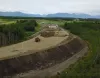 Placing enough fill to join both sections of the new South Trunk Road bridge took some time and plenty of manpower. The $19 million project, which had its ribbon cutting Friday, links Nelson 