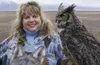 Randi Perlman smiles for a photo with Artemis the great horned owl on the Palmer Hay Flats a few years ago. Perlman was Artemis's caretaker for 15 years as a volunteer for the Anchorage Bird 