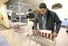 (ROBERT DeBERRY/Frontiersman) Junior Taase, left, and Ian
Sylvester set up voting booths at the First United Methodist Church
at Mile 4 of Knik-Goose Bay Road Monday afternoon. Polls are open