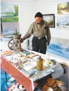 Curtis W. Wagner Jr. stands in his studio surrounded by his creations. Courtesy photo