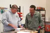 Alaska Home Brew Supply owner Brian Walters looks over a recipe with a customer in the shop on Friday, Sept. 25. The store opened in the City Center Wasilla business complex on Knik-Goose Bay