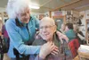 Dorothea Taylor jokes with her husband George Murphy Saturday
afternoon during Taylor's 86th birthday celebration. Taylor fended
off an agitated moose with a shovel after it had attacked her
