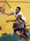 Colony's Jason Christensen drives the lane for a shot over a
West defender in the fourth quarter of Friday's game at Colony High
School. Photo by TIM BRODT/Frontiersman.