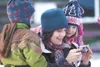 Kathy Swartz looks at a family picture with her son, Tyler, 4,
left, and daughter, Heather, 6, during last year’s Wasilla
Community Christmas Celebration . ROBERT DeBERRY/2010 Frontiersman
fi