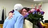 Out-going Houston city cleark Rebecca Rein hugs Councilman David Childs after the special city council meeting to certify election results. She is leaving to serve the State of Alaska and dur